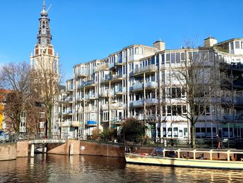 Church and canal in amsterdam on a sunny day