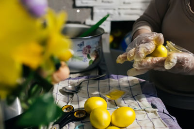 Midsection of man preparing food on table