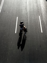 High angle view of man with umbrella on street