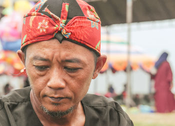 Portrait of a man wearing traditional javanese clothing at a traditional event