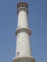 Low angle view of lighthouse against clear blue sky