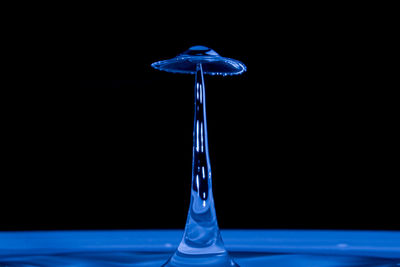 Close-up of water splashing against black background