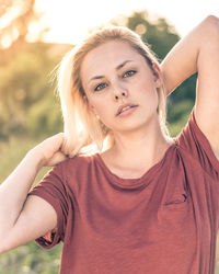 Portrait of young woman standing outdoors