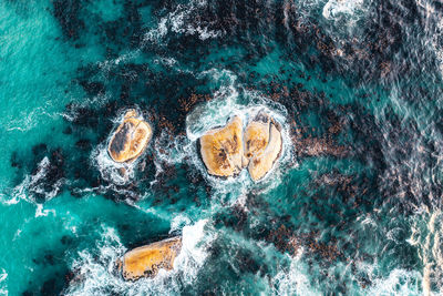 Sea waves splashing on rocks