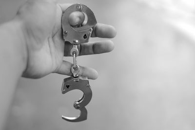 Close-up of person working on metal