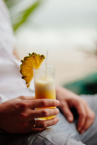 Close-up of man hand holding drink