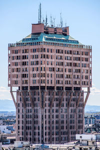 View of buildings in city against clear sky