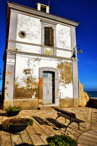 Exterior of old building against blue sky