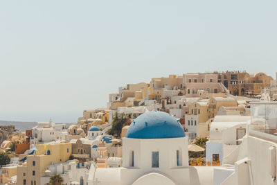 Townscape against clear blue sky