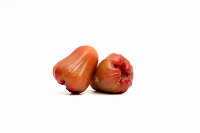 Close-up of fruits against white background