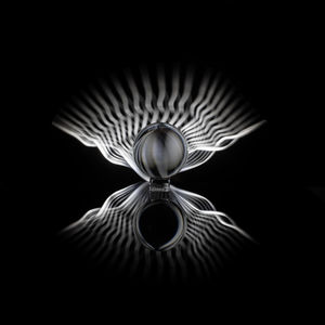 Digital composite image of metal against black background