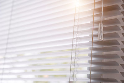 Close-up of blinds on glass window