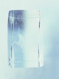 Close-up of glass over white background