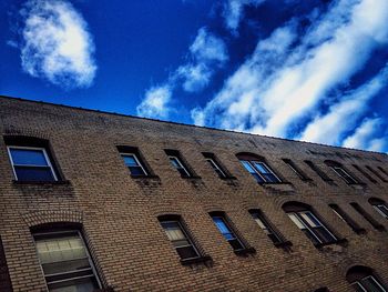 Low angle view of building against blue sky