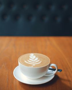 Close-up of cappuccino on table