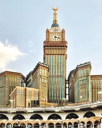 Low angle view of buildings in city against sky