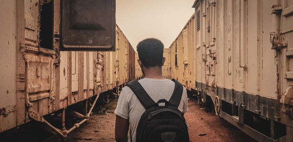 Rear view of man standing on train