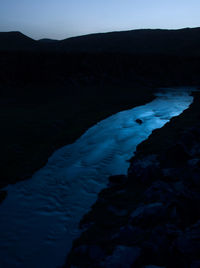 Scenic view of landscape against sky at night