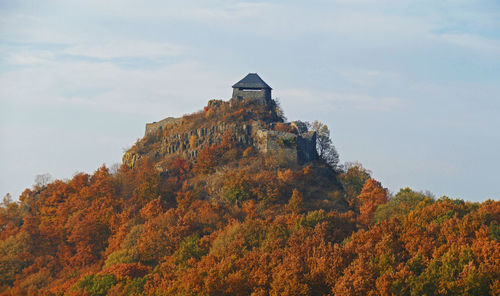Low angle view of historic building against sky during autumn