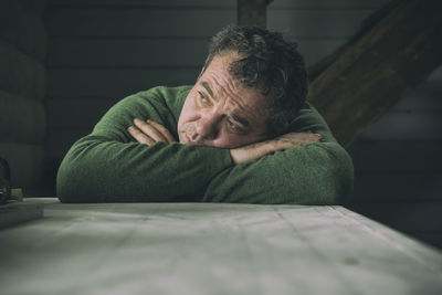 Close-up of depressed man indoors