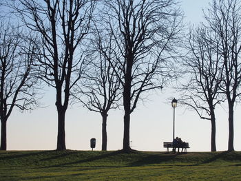 Silhouette bare trees against sky during sunset