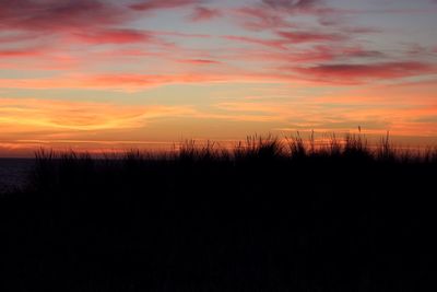 Silhouette of landscape against dramatic sky