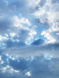 Low angle view of airplane flying in sky