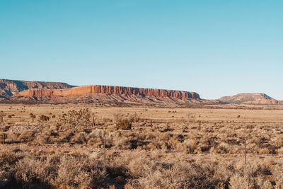 Scenic view of desert against clear sky