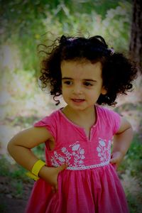 Portrait of young woman standing outdoors