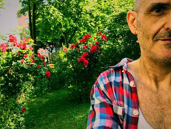 Midsection of man with flowers