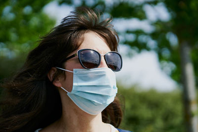 Woman in mask in park