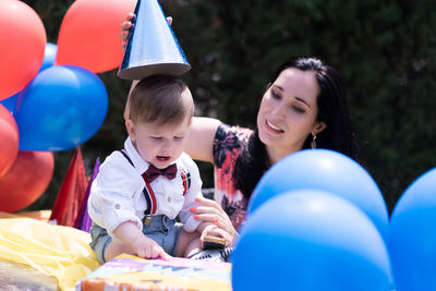 Portrait of boy with balloons