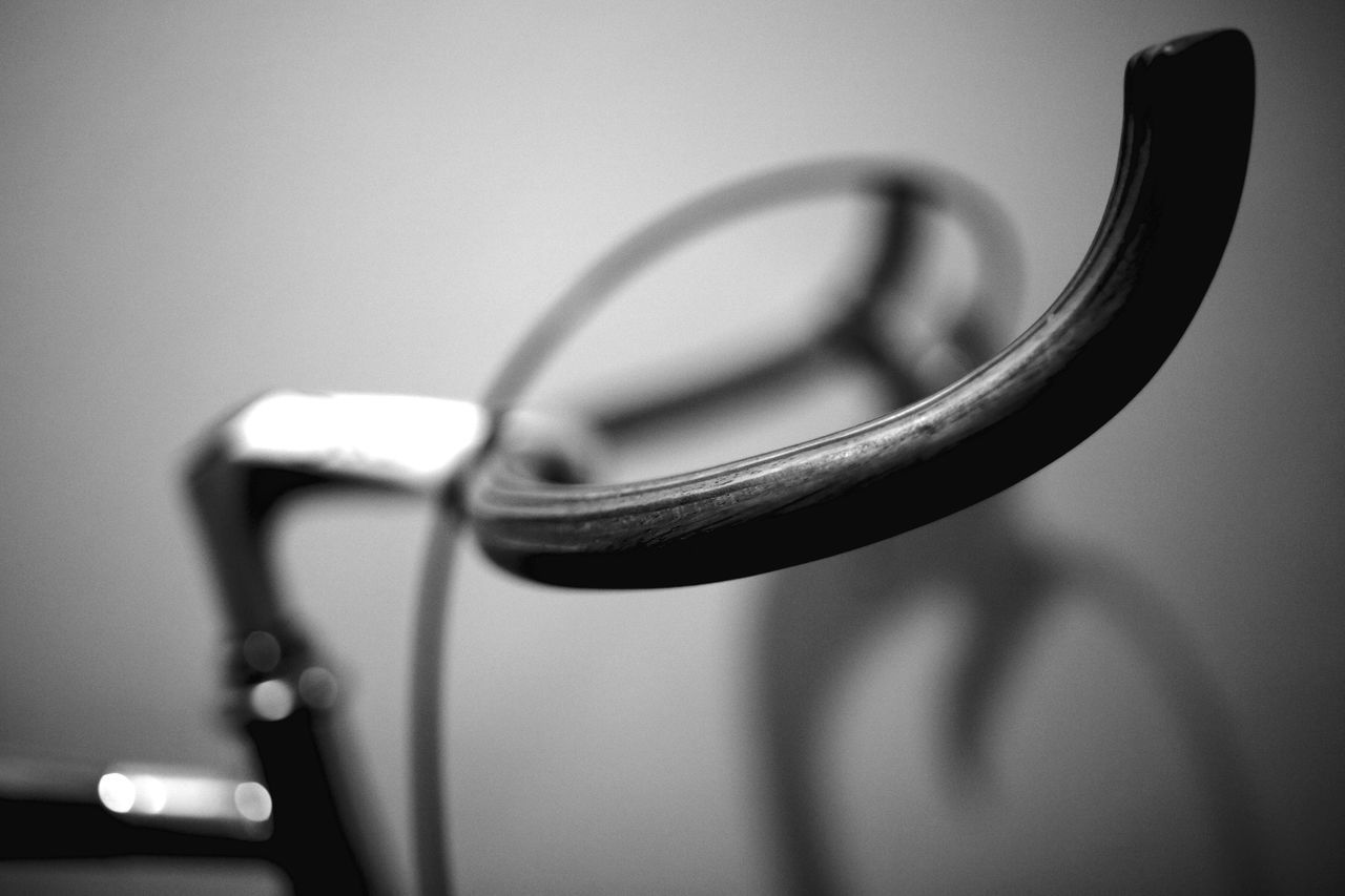 indoors, close-up, still life, single object, focus on foreground, table, selective focus, metal, studio shot, music, no people, handle, reflection, two objects, arts culture and entertainment, white background, musical instrument, simplicity, part of, shiny