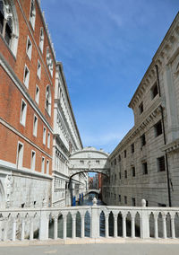 Low angle view of buildings against blue sky