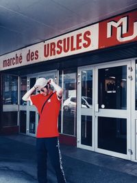 Man standing in front of building