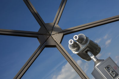 Low angle view of coin-operated binoculars