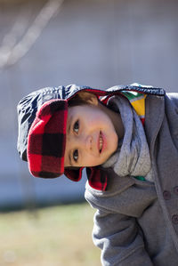 Close-up portrait of cute boy in warm clothing