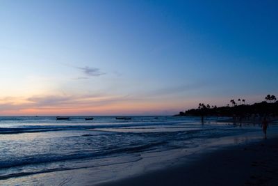 Scenic view of beach at sunset