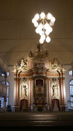 Low angle view of illuminated chandelier in building