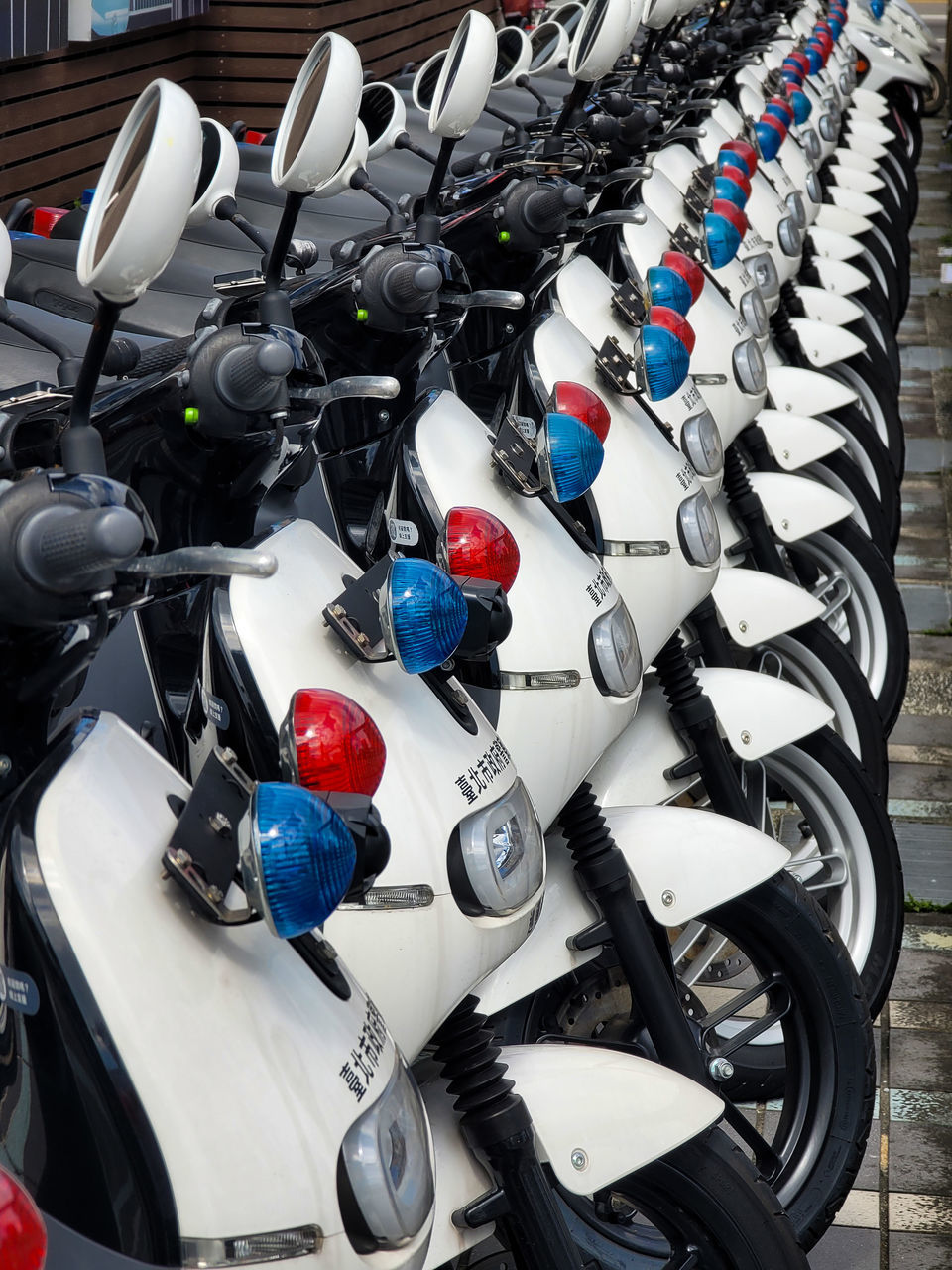 vehicle, car, motorcycle, land vehicle, transportation, motorcycling, mode of transportation, large group of objects, in a row, no people, sports