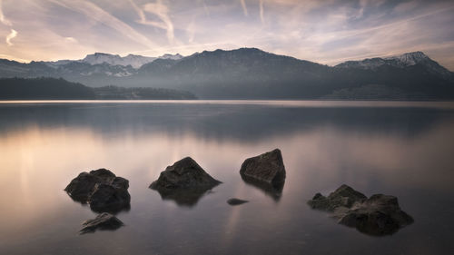 Scenic view of lake against sky during sunset