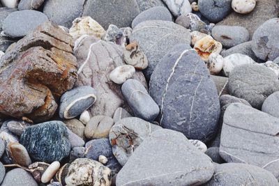 High angle view of stones on pebbles