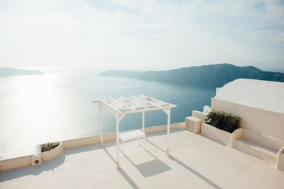 Scenic view of swimming pool by sea against sky