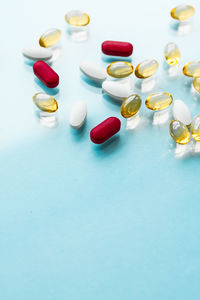 Close-up of pills on blue background