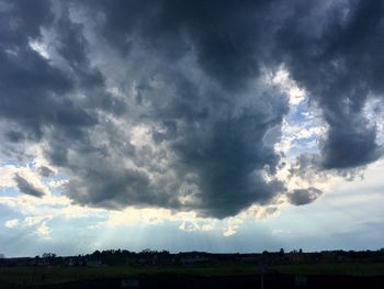 Storm clouds over field