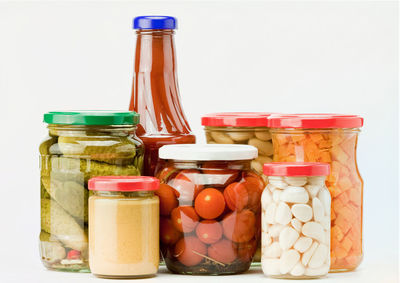 Close-up of drink in jar against white background