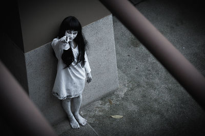 High angle view of woman standing outdoors