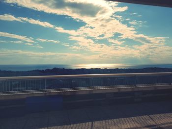 Bridge over river against sky during sunset