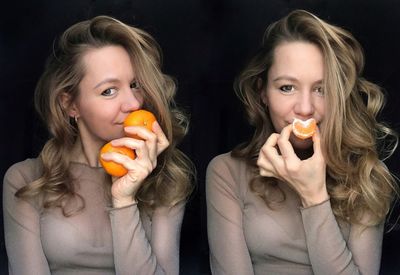 Portrait of young woman holding fruits