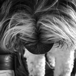 Close-up of woman with hand hair